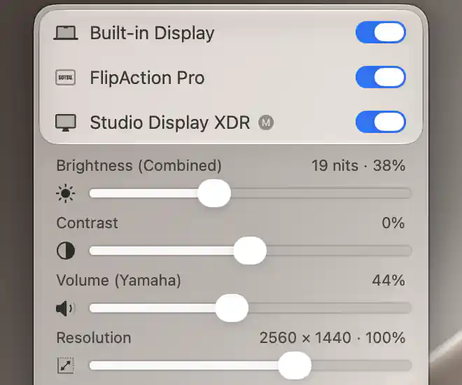 Studio Display XDR sliders showing combined brightness with nits, software contrast, Yamaha volume with its mute icon, and resolution