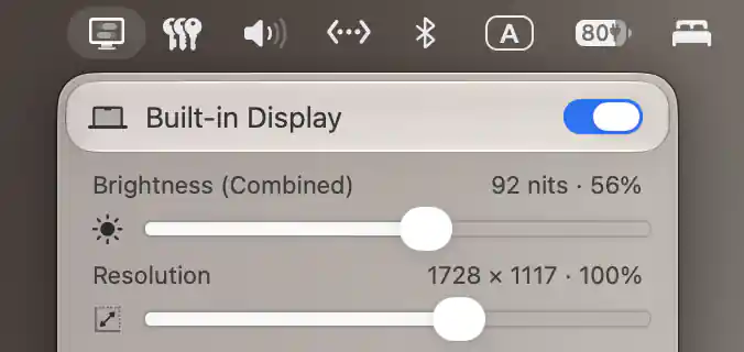 Built-in Display combined brightness and resolution sliders with reported nits and current desktop dimensions