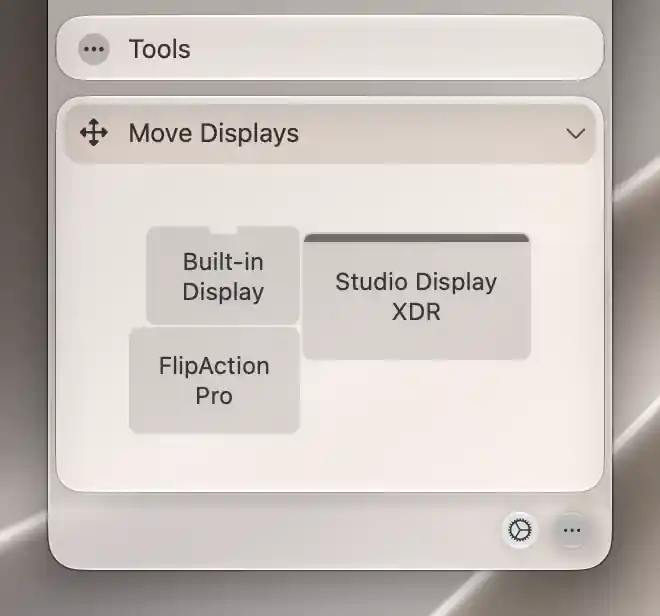 Move Displays canvas showing three connected displays and the main-display bar on Studio Display XDR