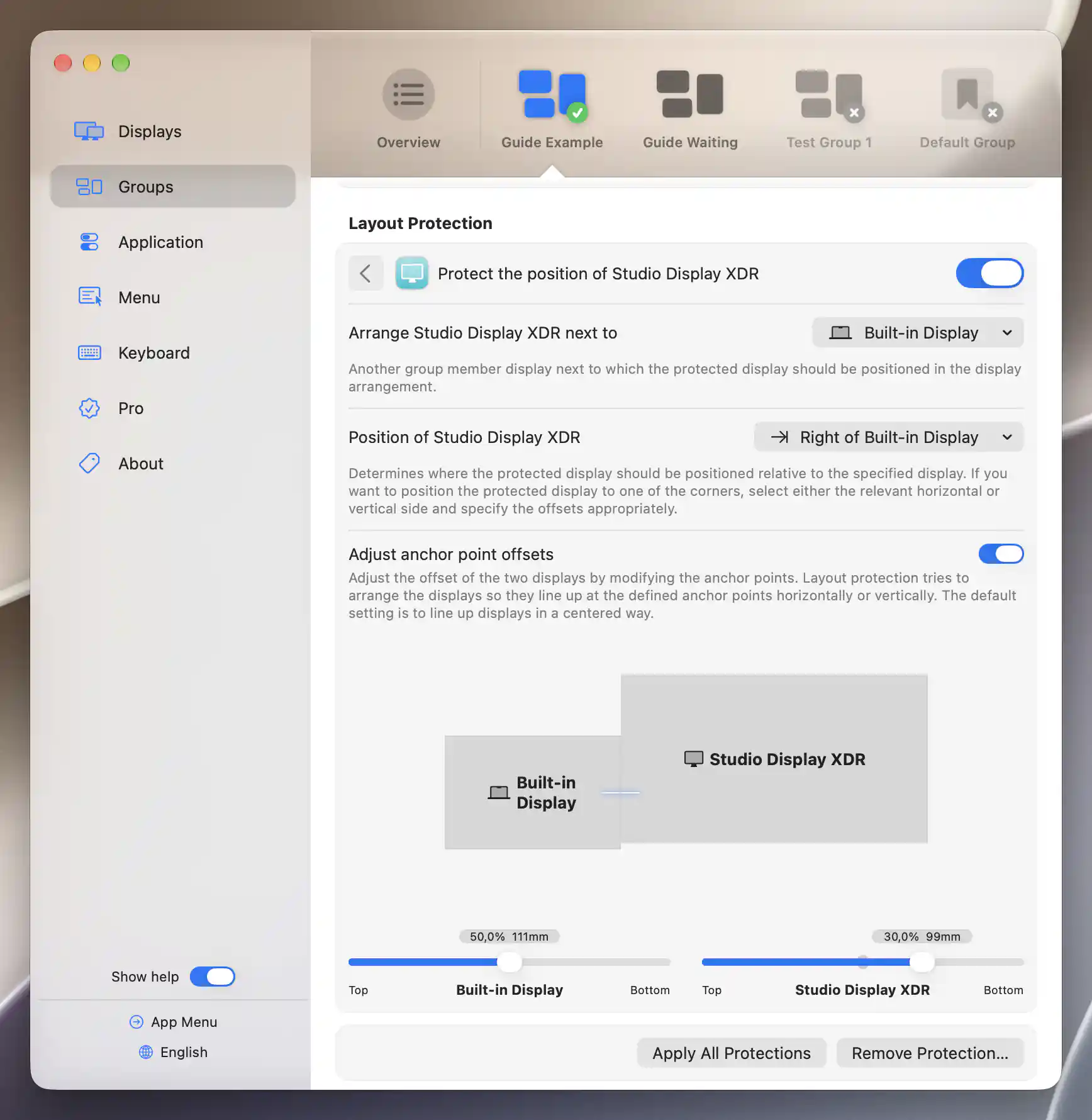 Studio Display XDR positioned right of Built-in Display with graphical anchor alignment and 50 percent and 30 percent offsets